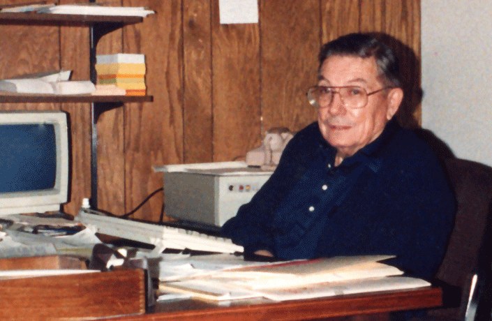 John Weinard at the reception desk in his Clinton Avenue, Minneapolis office, in the late 1980s.